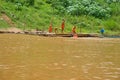 The novice buddhist monks playing on the Mekong river in Luang Prabang, Laos Royalty Free Stock Photo