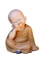 The novice doll is smiling and closing his eyes and sitting with his hands on his chin isolated on white background..