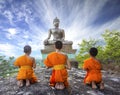 Novice Monk praying to the Buddha in Phrabuddhachay Temple Royalty Free Stock Photo