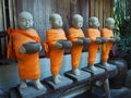 Novice statue, Beautiful small clay sculpture in a Thai temple