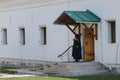 Novodevichy Monastery in early spring. A nun enters the monastery building. Moscow. Russia Royalty Free Stock Photo