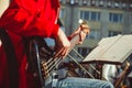 Novokuzneck, Russia - 13.08.2017: the bass guitarist plays in an orchestra on the street