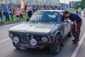 Novokuznetsk, Russia-June 14, 2019: The 7th Peking to Paris Motor Challenge 2019. BMW 2002 Ti 1971 leaving the city and going to