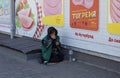 Novomoskovsk, Ukraine - May 13, 2021: Beggar woman on street asking for money. Beggars. Social problem. Social