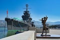 Woman with a child stature near the cruiser Mikhail Kutuzov in Novorossiysk Royalty Free Stock Photo