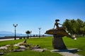 Girl on a dolphin sculpture on the Novorossiysk city embankment