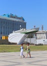 Two tourists on the background of the monument to the torpedo boat during the second world war in Novorossiysk