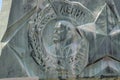 Coat of arms with a bas-relief of Lenin on the monument. The leader of the revolution Royalty Free Stock Photo