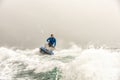 Jet ski watercraft driver driving waterbike in open Black Sea at storm