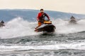 Men driving jet ski watercrafts in open Black Sea Royalty Free Stock Photo