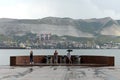 People at the ancient nuclear guns on the shore of the bay in the hero city of Novorossiysk