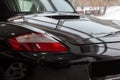 Rear quarter view of the 2006 sport porsche boxster s sedan prepared for sale and exhibited in the showroom with a polished shiny