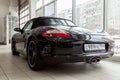 Rear view of the 2006 sport porsche boxster s sedan prepared for sale and exhibited in the showroom with a polished shiny black