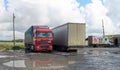 Novosibirsk, Russia - August 25 2017 Large trucks MAN from Kazakhstan are resting, have puddles in the Parking lot at the cafe