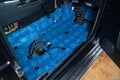 Car tuning in the body of a SUV using three layers of noise insulation Blockshot comfortmat premium. Audio and vibration isolation