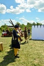 Several men in historical costumes with weapons stand in line in front of their commanders Royalty Free Stock Photo