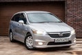 Front view of a Honda Stream car in a silver body Japanese 2008 year van in a parking Royalty Free Stock Photo