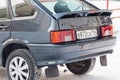 Green lada 2114 year front view with dark gray interior in excellent condition in a parking space among other cars