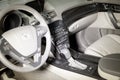 The interior of the car Acura MDX with a view of the steering wheel, dashboard, seats and multimedia system with light gray