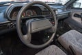 The interior of the car lada 2114 samara with a view of the steering wheel, dashboard, seats and multimedia system with light gray