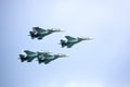 Aerobatic team VKS `Russian Falcons` Su-30 SM, four russian fighter aircrafts in the cloudy sky