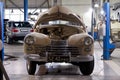 Russian classic vintage car gaz m20 pobeda part of the history in a repair shop in good condition in a disassembled condition with