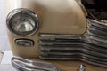 Russian classic vintage car gaz m20 pobeda part of the history in a repair shop in good condition front headlamp view