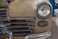 Russian classic vintage car gaz m20 pobeda part of the history in a repair shop in good condition front headlamp view