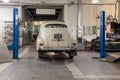 Russian classic vintage car gaz m20 pobeda part of the history in a repair shop in good condition rear view