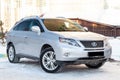 Silver Lexus RX450h 2009 release with an hybrid engine of 3.5 liters front view on the car snow parking after preparing for sale