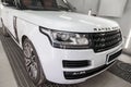 White and black Land Rover Range Rover Autobiography front view in auto service garage waiting for wash and detailing