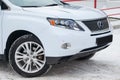 White Lexus RX450h 2009 release with an hybrid engine of 3.5 liters front view on the car snow parking after preparing for sale