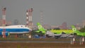 Military airplane taxiing through the airfield