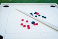 Novuss (also known as koroona or korona) is a large wooden board game where small wooden discs are hit with cue sticks Royalty Free Stock Photo