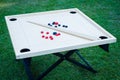 Novuss (also known as koroona or korona) is a large wooden board game where small wooden discs are hit with cue sticks Royalty Free Stock Photo