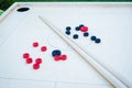 Novuss (also known as koroona or korona) is a large wooden board game where small wooden discs are hit with cue sticks Royalty Free Stock Photo