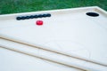 Novuss (also known as koroona or korona) is a large wooden board game where small wooden discs are hit with cue sticks Royalty Free Stock Photo