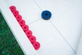 Novuss (also known as koroona or korona) is a large wooden board game where small wooden discs are hit with cue sticks Royalty Free Stock Photo