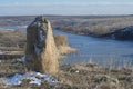 Novyi Buh, Mykolaiv region, Ukraine - March 9, 2021: Granite rocks on the winter banks of the river Ingul, Ukraine