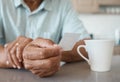 Now all I have are the memories. an unrecognizable person holding a photo while drinking coffee at home. Royalty Free Stock Photo