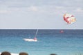 A boat and its vacationists on the parachute