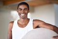 Now for that full body workout. Portrait of a smiling young man holding a fitness ball. Royalty Free Stock Photo