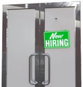 Now Hiring help sign on business door Royalty Free Stock Photo