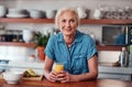 Now this is how to start a day. Cropped portrait of an attractive senior woman enjoying a glass of orange juice while Royalty Free Stock Photo