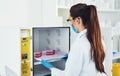 Now for just a little wait. Rearview shot of an unrecognizable young female scientist wearing protective fave gear while Royalty Free Stock Photo