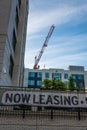 Now leasing sign and newly built apartments Royalty Free Stock Photo
