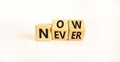 Now or never symbol. Turned wooden cubes and changed the word `never` to `now` or vice versa. Beautiful white background, copy