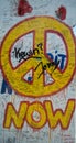 Now peace graffiti sign on the Berlin wall