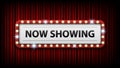 Now showing with electric bulbs frame on red curtain background