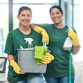 Now thats our kinda clean. Portrait of two young woman cleaning a modern office.